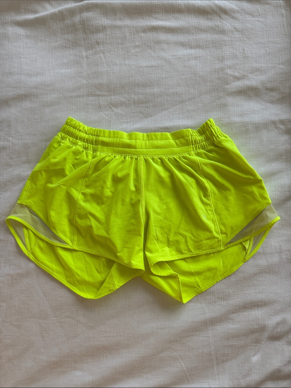 neon yellow Lululemon hotty hot 4” shorts